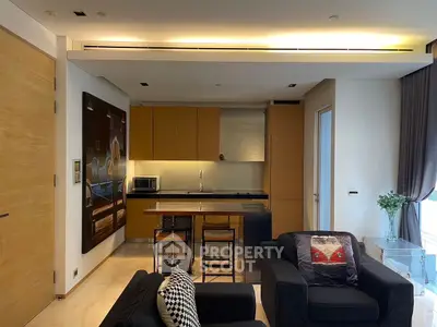 Modern open-layout kitchen with stylish seating and contemporary decor