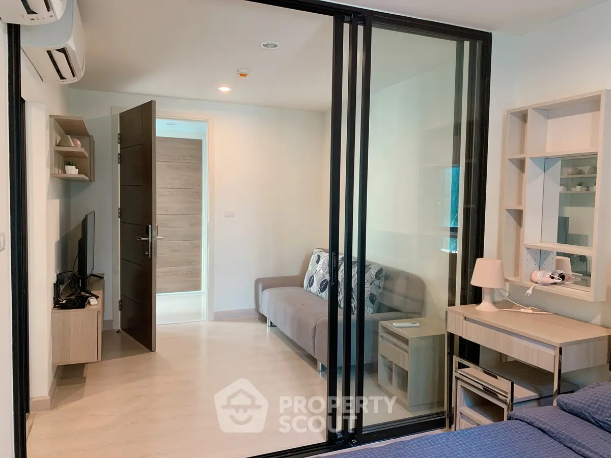 Modern apartment interior with sliding glass doors and stylish furniture