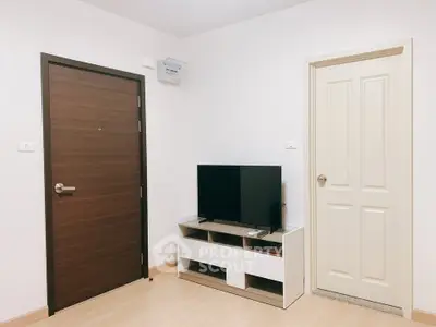 Modern living room with TV and wooden doors, minimalist design