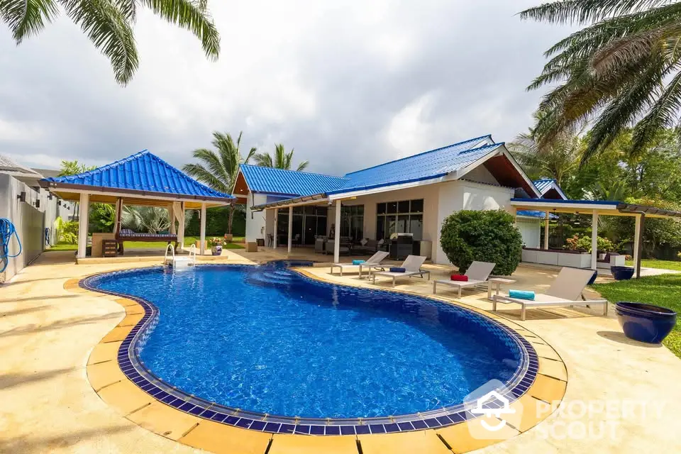 Luxurious villa with private pool and tropical garden, perfect for relaxation and entertaining.