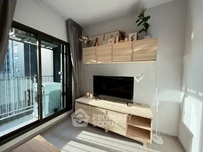 Modern living room with sleek furniture and balcony view