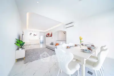 Spacious modern living room with elegant dining area and stylish decor