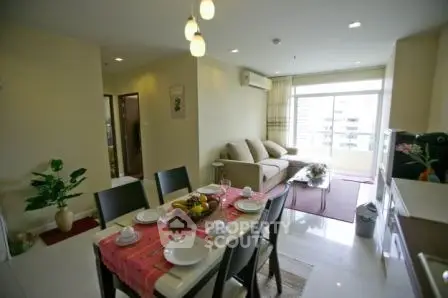 Spacious living and dining area with modern decor and natural light