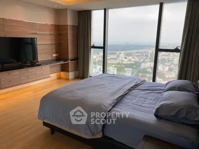 Luxurious bedroom with stunning city view and modern decor