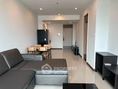 Modern living room with sleek furniture and open layout in a contemporary apartment.