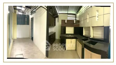 Modern kitchen with sleek cabinetry and open layout, featuring a gas stove and ample counter space.