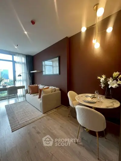 Modern living room with stylish decor and dining area, featuring floor-to-ceiling windows and elegant lighting.