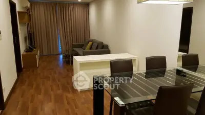 Spacious living room with modern dining area and cozy seating, perfect for entertaining guests.