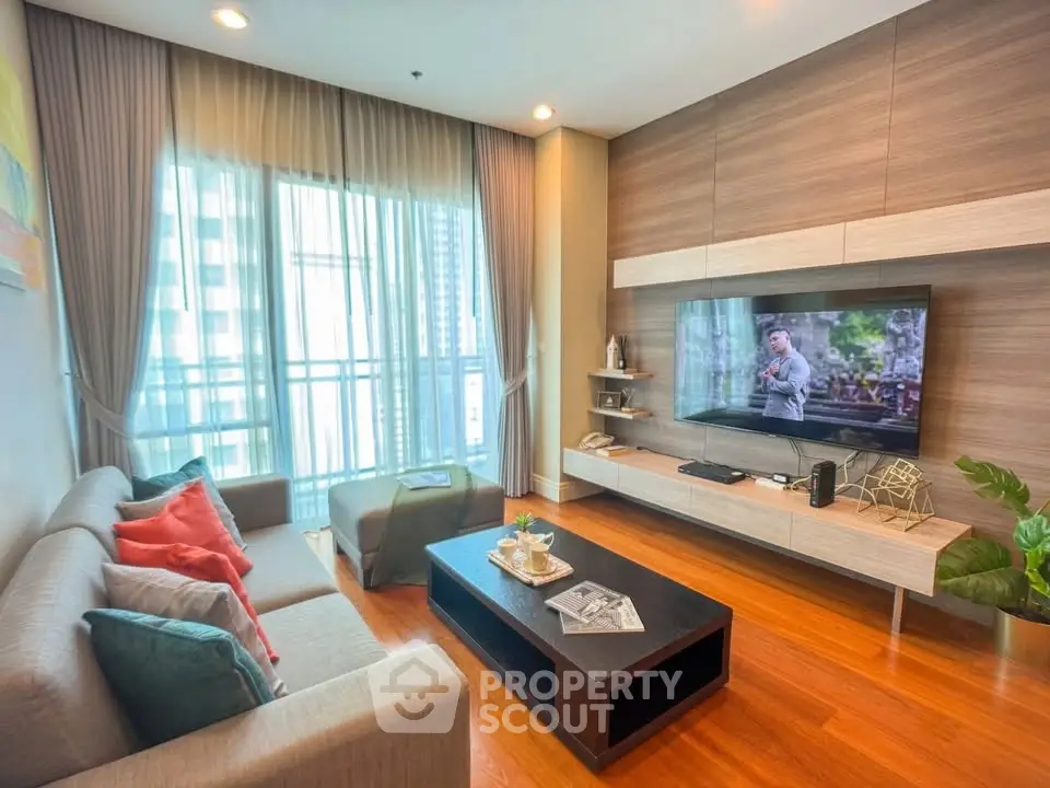 Modern living room with stylish decor and large window view in urban apartment
