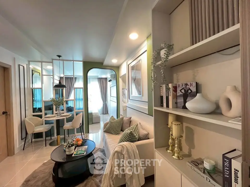 Stylish modern living room with elegant decor and open dining area, perfect for urban living.