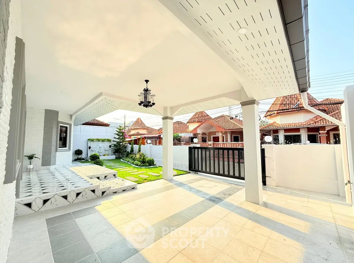 Charming suburban home with spacious covered patio and lush green garden, perfect for outdoor relaxation.