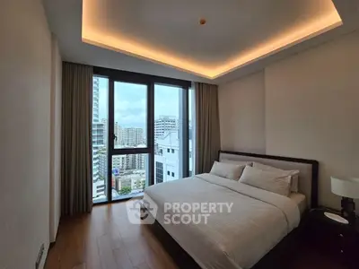 Modern bedroom with city view and elegant lighting in high-rise apartment