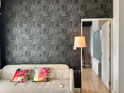 Stylish living room with modern wallpaper and colorful cushions, perfect for urban living.