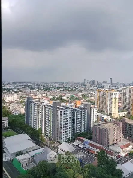 Stunning cityscape view from high-rise apartment showcasing urban living.