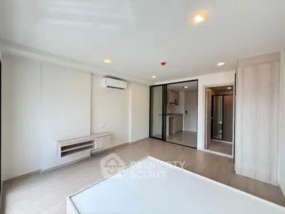 Modern unfurnished apartment interior with open layout and air conditioning