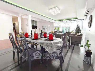 Spacious open-plan living and dining area with elegant decor and natural light.