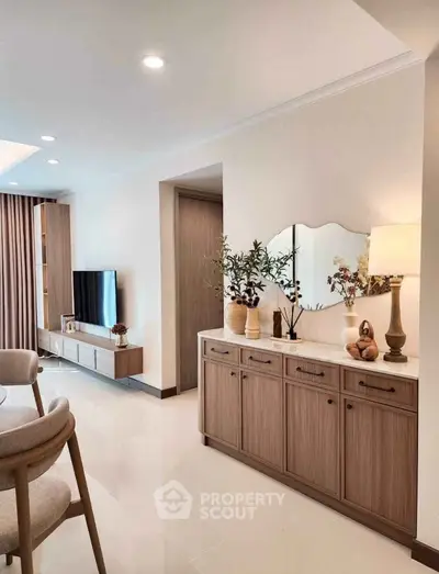 Elegant living room with modern decor, stylish furniture, and ambient lighting for a cozy atmosphere.