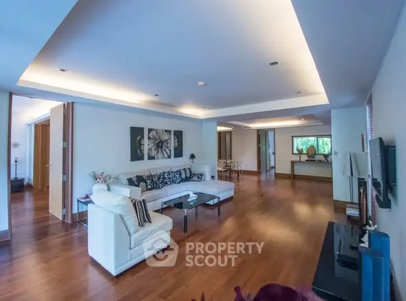 Spacious modern living room with elegant decor and hardwood floors
