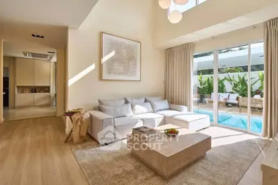Luxurious living room with pool view and modern decor