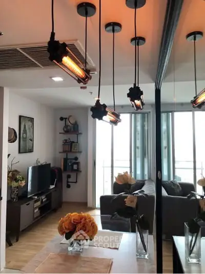 Modern living room with stylish decor and large windows