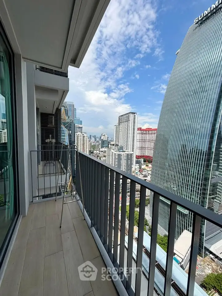 Stunning city view from a modern high-rise balcony, perfect for urban living.