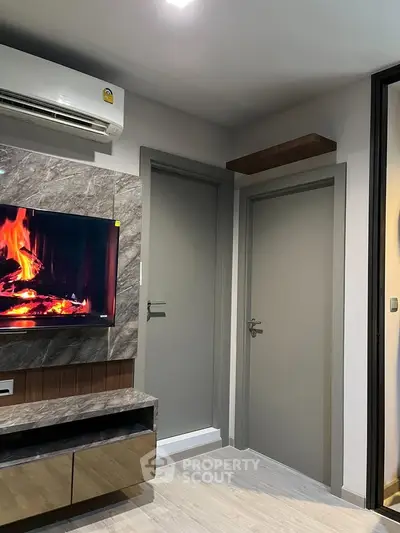 Modern living room with stylish decor and wall-mounted TV