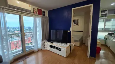 Modern living room with balcony view and open kitchen layout in urban apartment