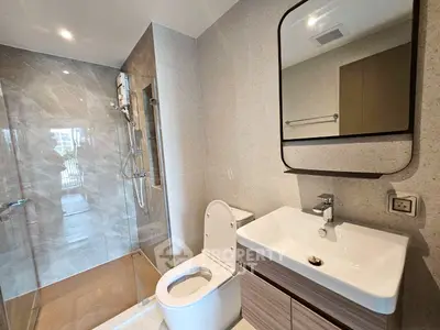 Modern bathroom with sleek design and glass shower enclosure