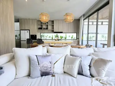 Luxurious open-plan living room with modern kitchen and elegant decor