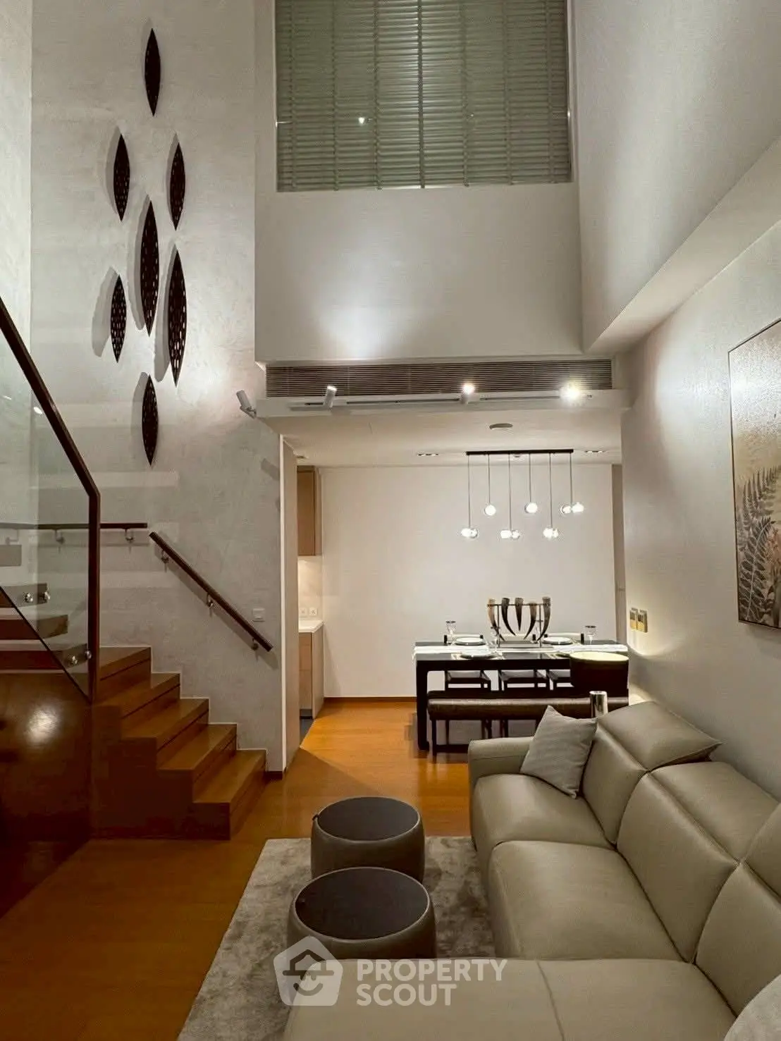 Luxurious modern living room with high ceiling and elegant decor