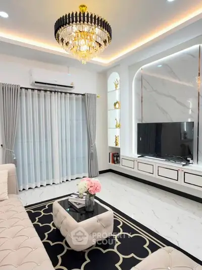 Luxurious living room with elegant chandelier and modern decor