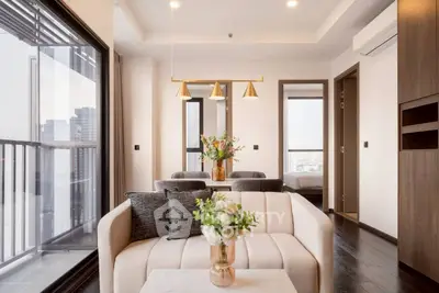 Modern living room with elegant decor and city view balcony