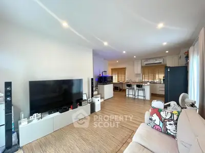 Spacious modern living room with open kitchen and stylish decor