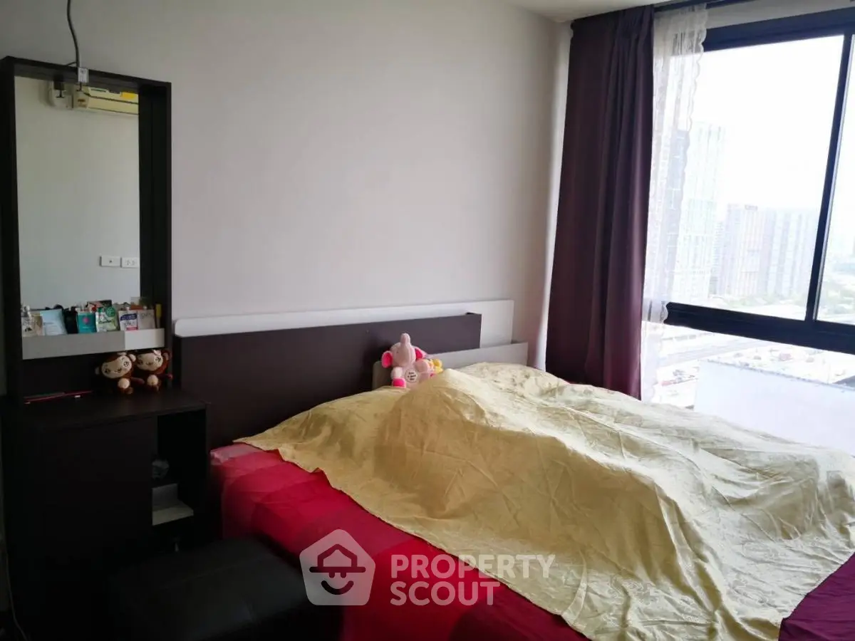 Cozy bedroom with city view and modern furnishings