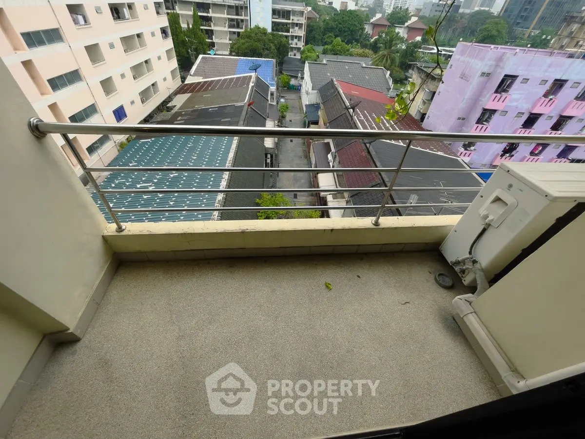 Charming balcony with city view, perfect for relaxation and enjoying urban scenery.