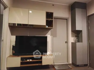 Modern living room with sleek TV unit and stylish storage cabinets
