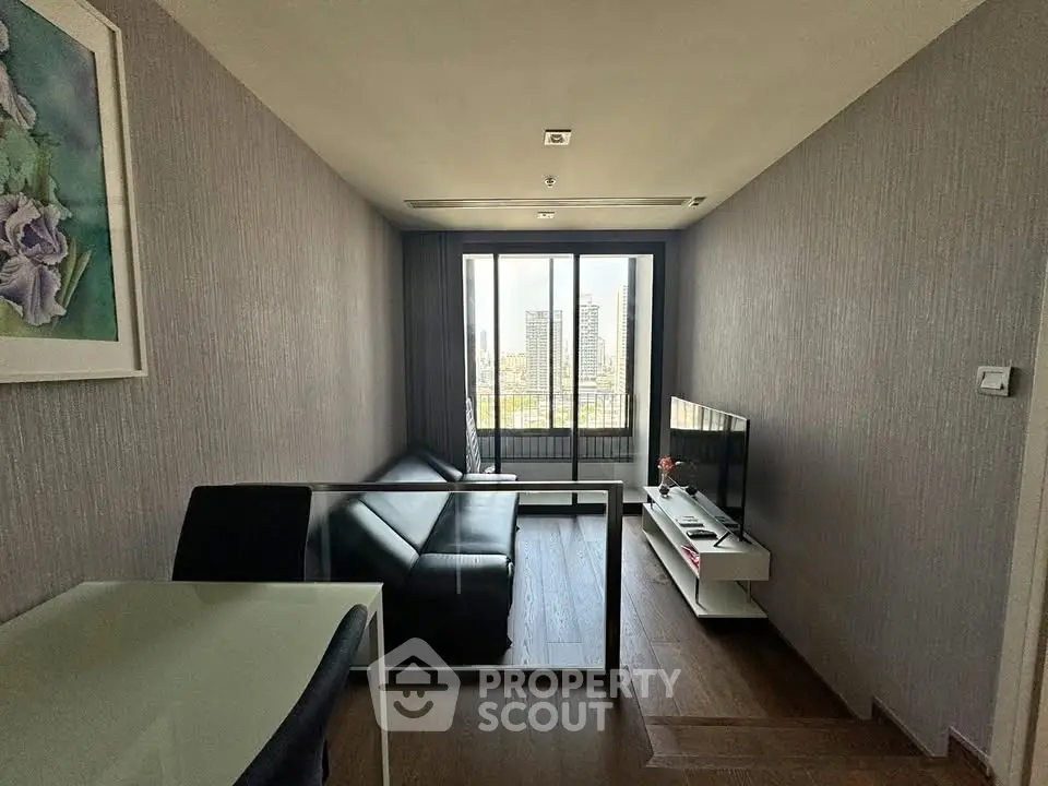 Modern living room with sleek furniture and city view, perfect for urban living.