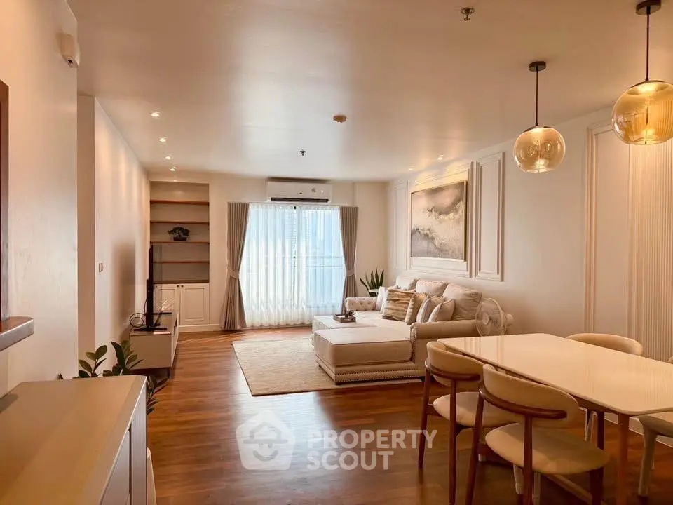 Spacious and elegant living room with modern decor and natural light