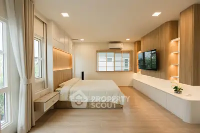 Spacious modern bedroom with elegant wood paneling and large windows