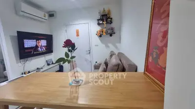 Modern living room with wall-mounted TV and stylish decor