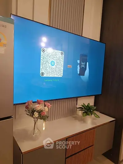 Modern living room with large Samsung TV and stylish decor