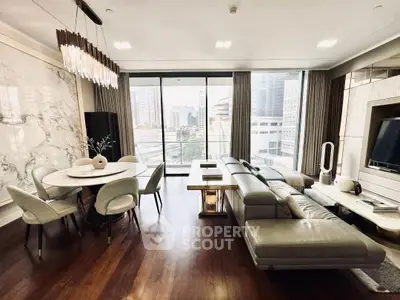 Luxurious modern living room with city view, elegant furniture, and stylish decor in a high-rise apartment.