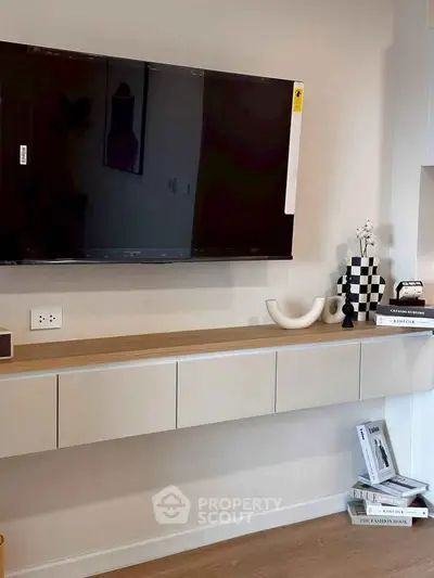 Modern living room with wall-mounted TV and stylish decor