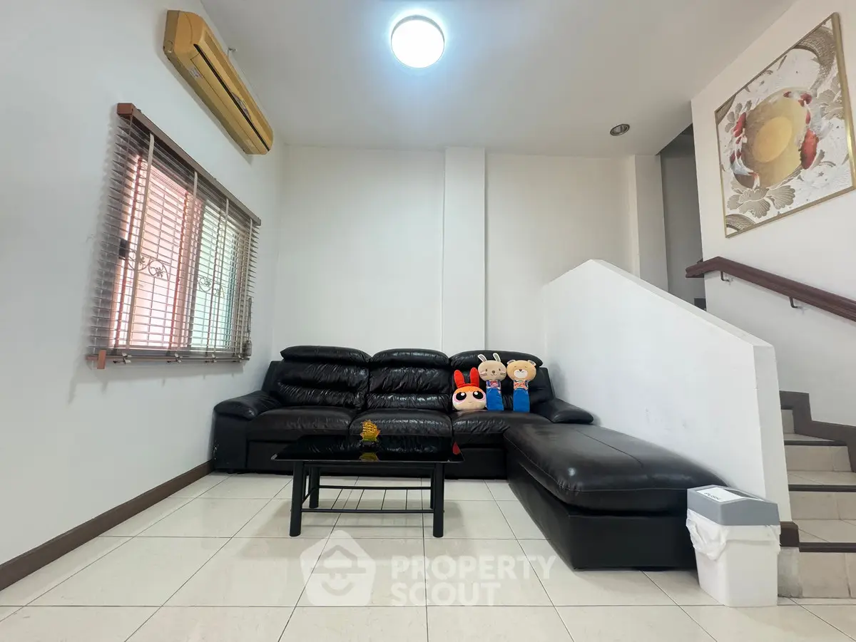 Spacious living room with modern leather sofa and stylish decor