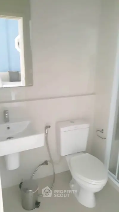 Modern bathroom with sleek fixtures and a clean design, perfect for a contemporary home.