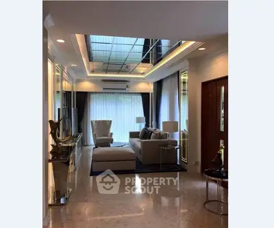 Luxurious living room with elegant decor and large windows for natural light.