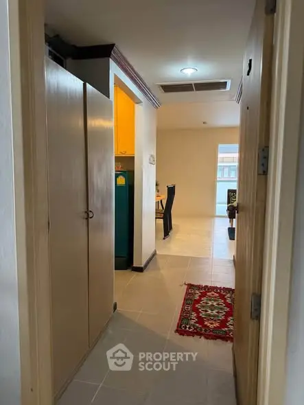 Charming apartment entrance with cozy hallway and vibrant decor.