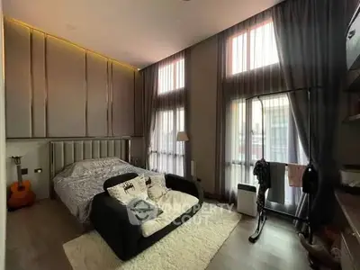 Luxurious bedroom with high ceilings and modern decor
