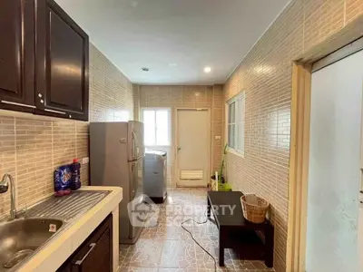 Spacious kitchen with modern appliances and ample natural light