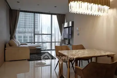 Luxurious modern living room with city view and elegant chandelier